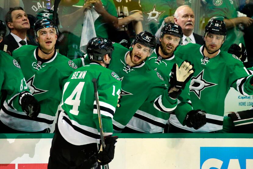 Dallas Stars left wing Jamie Benn (14) is congratulated by center Tyler Seguin (91) and...