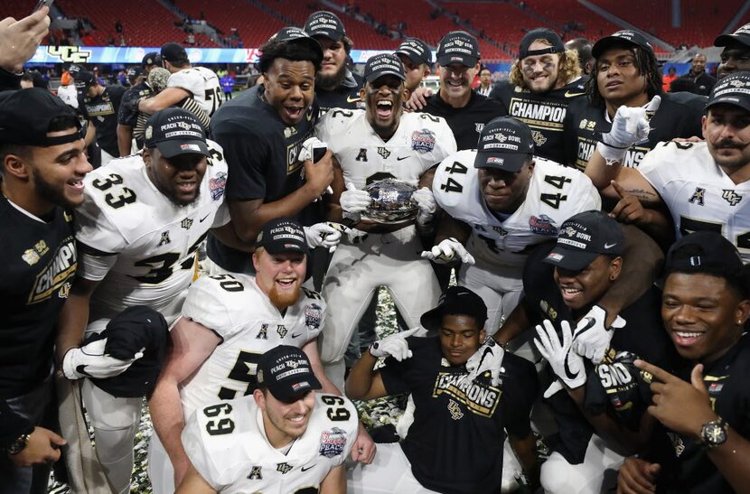 ATLANTA, GA - JANUARY 01:  The UCF Knights celebrate defeating the Auburn Tigers 34-27 to...