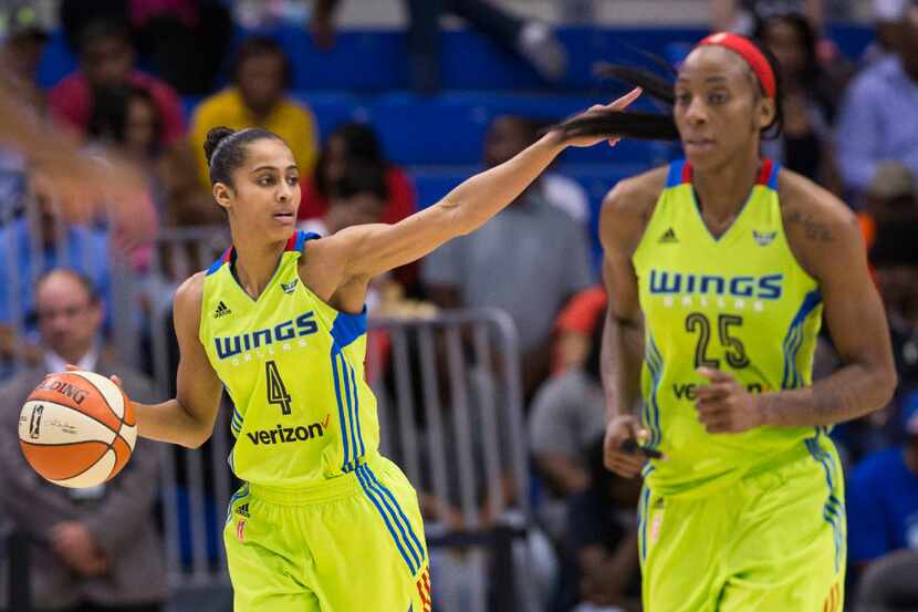 Dallas Wings guard Skylar Diggins-Smith (4) and forward Glory Johnson (25) make their way...