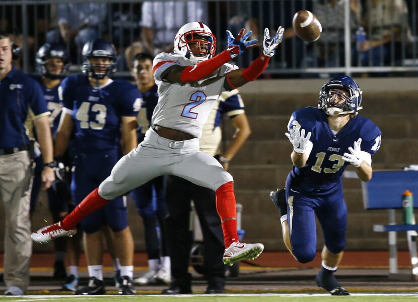 Skyline defensive back Jonathan Spencer (2) breaks up the pass intended for Jesuit wide...