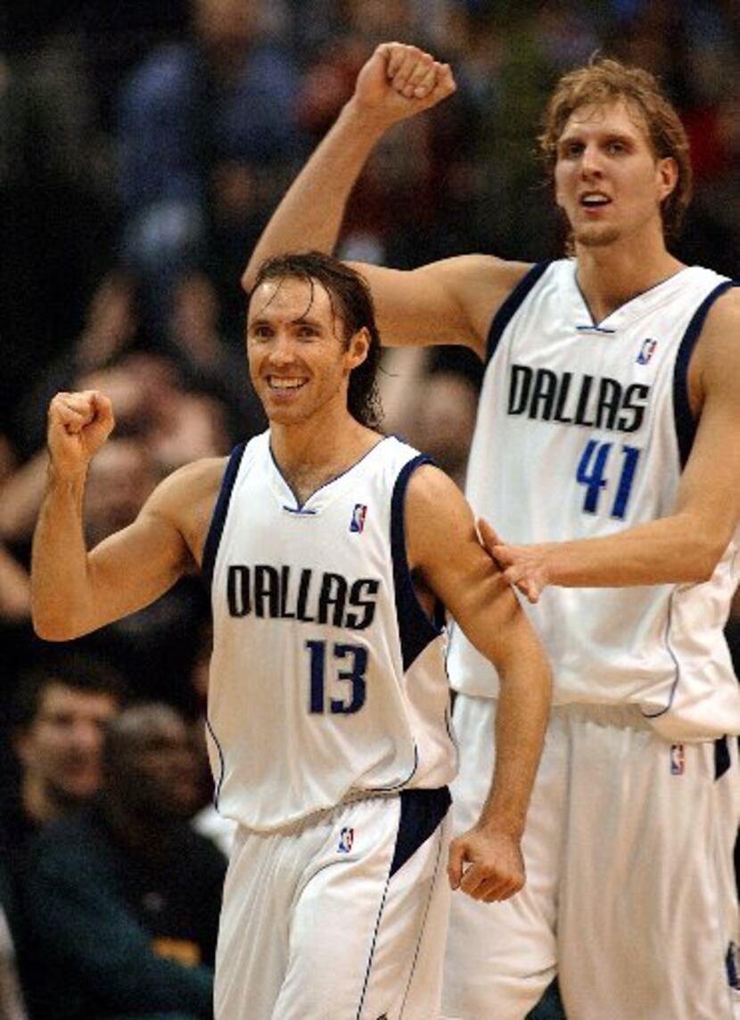 Steve Nash (L) and Dirk Nowitzki (R) of the Dallas Mavericks react to their come-from-behind...