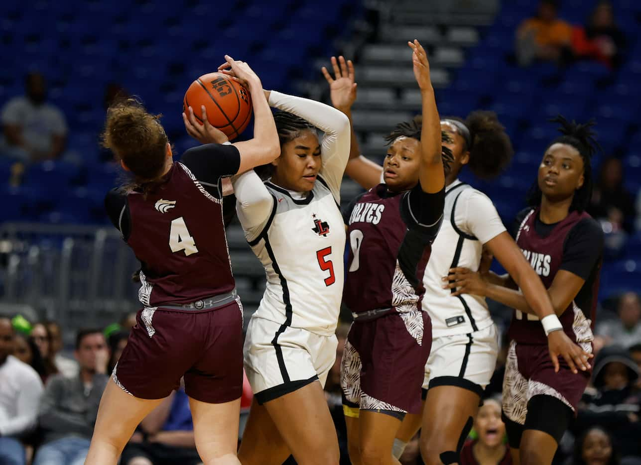 Frisco Liberty's Keyera Roseby (5) is trapped by Mansfield Timberview's Brooklyn Terry (4)...