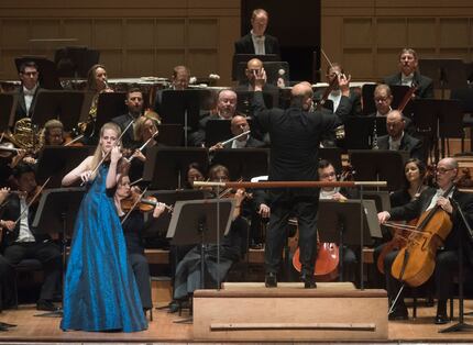 Led by Conductor Jaap Van Sweden, right, Violinist Simone Lamsma performs with the Dallas...