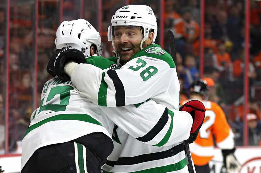 Vernon Fiddler #38 of the Dallas Stars celebrates with teammates after scoring the...