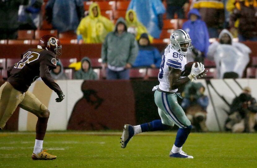 Dallas Cowboys wide receiver Dez Bryant (88) makes a catch over Washington Redskins...