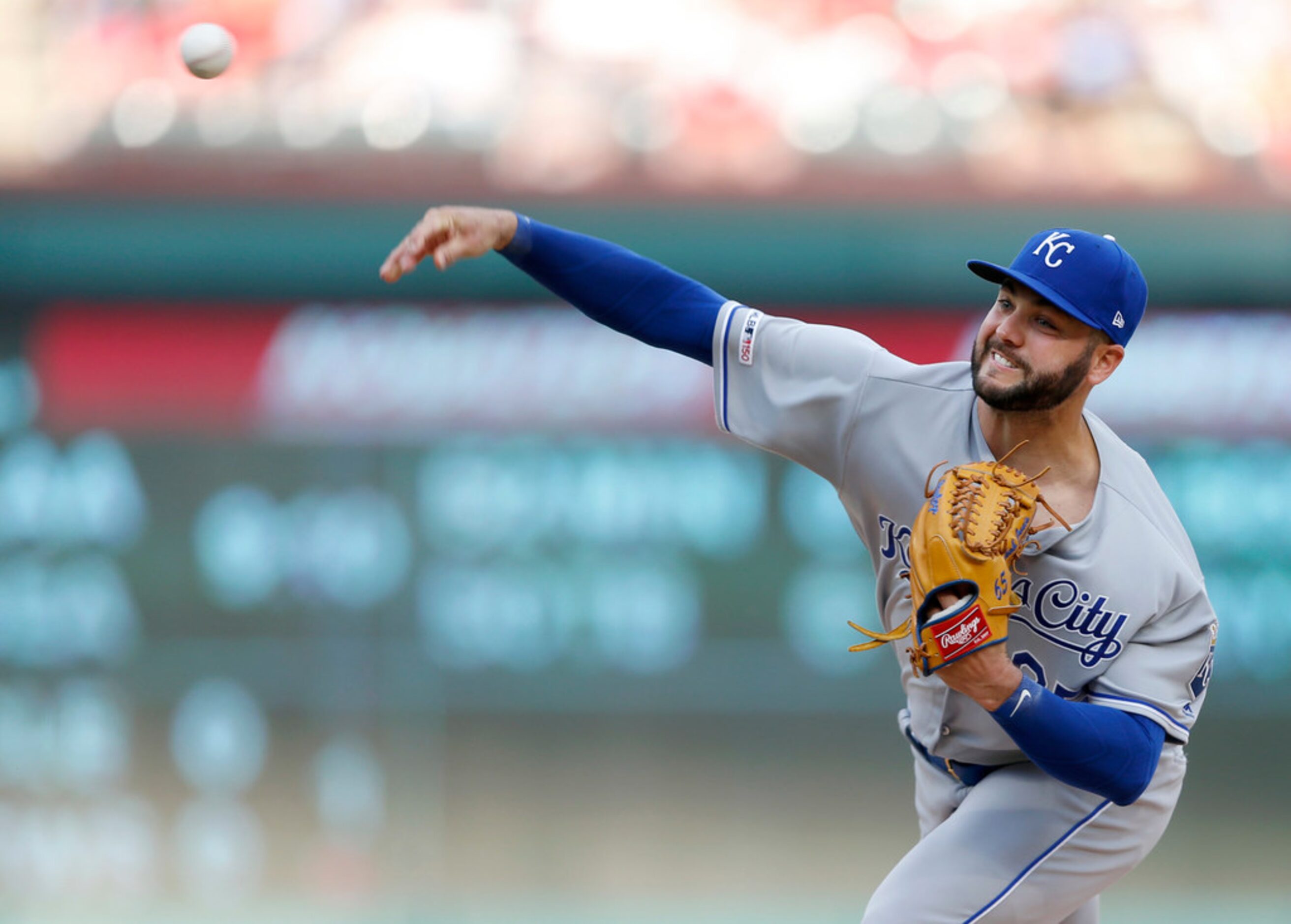 Kansas City Royals starting pitcher Jakob Junis (65) pitches in the first inning of play in...