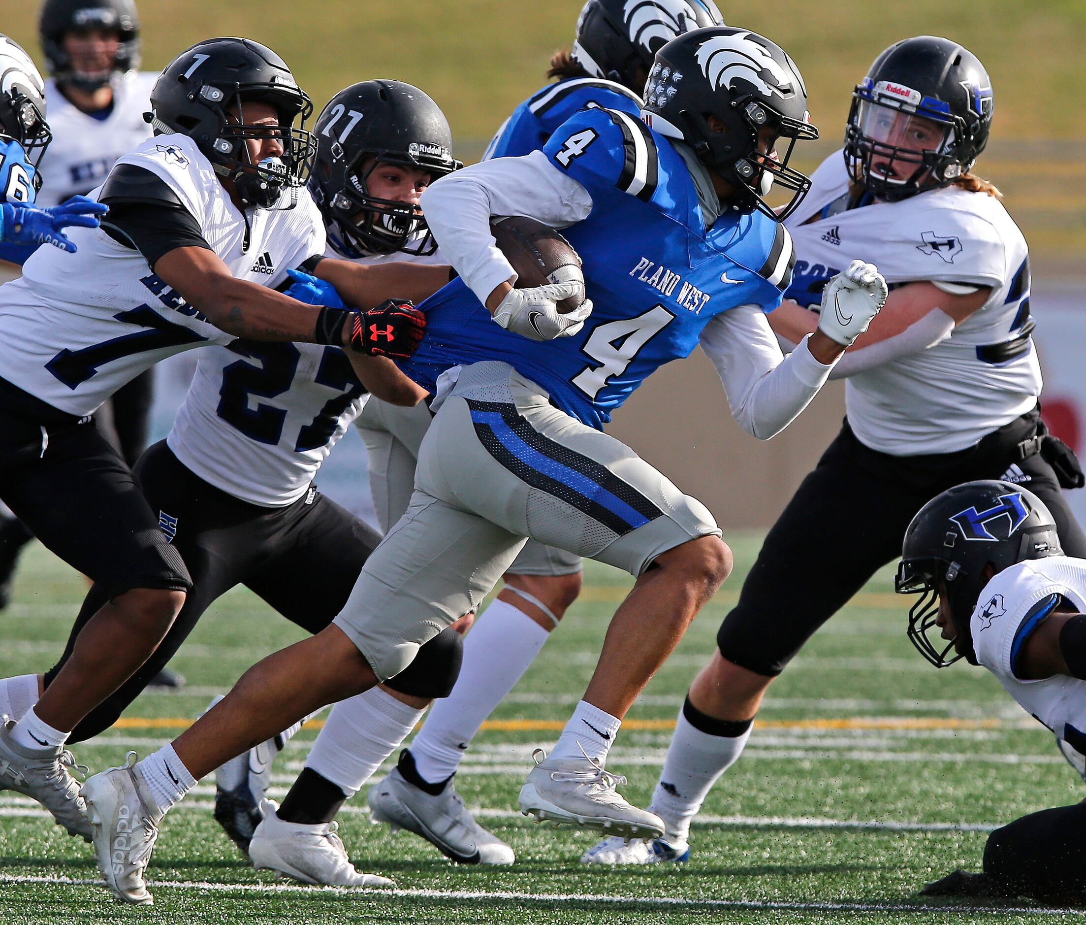 Plano West High School wide receiver Tyler Harrell (4) looks for room to run during the...