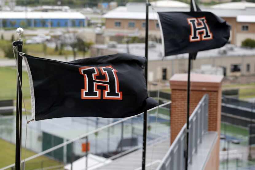 Heath High flags fly atop Wilkerson-Sanders Memorial Stadium in Rockwall.  (John F. Rhodes /...
