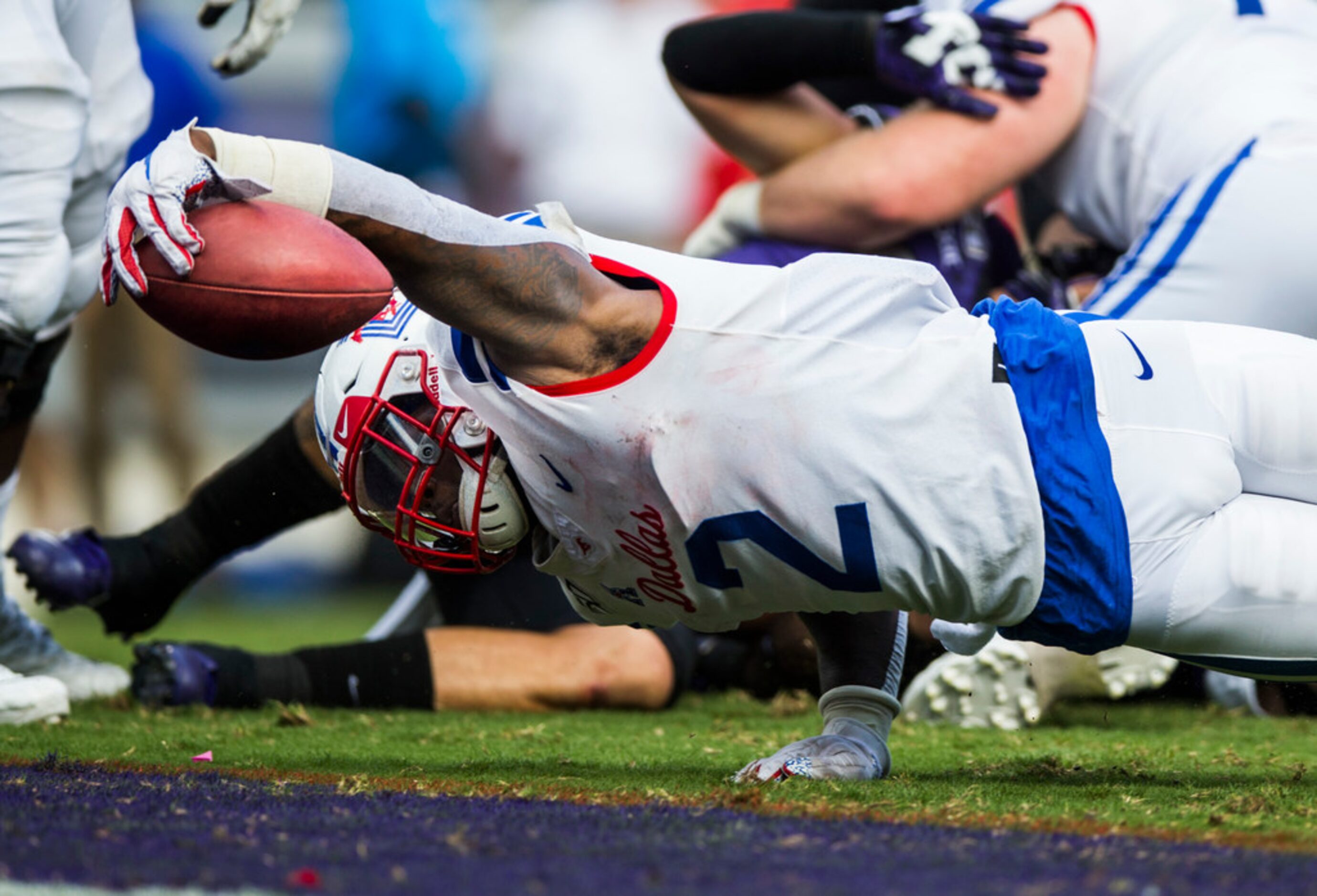 Southern Methodist Mustangs running back Ke'Mon Freeman (2) dives across the goal line for a...