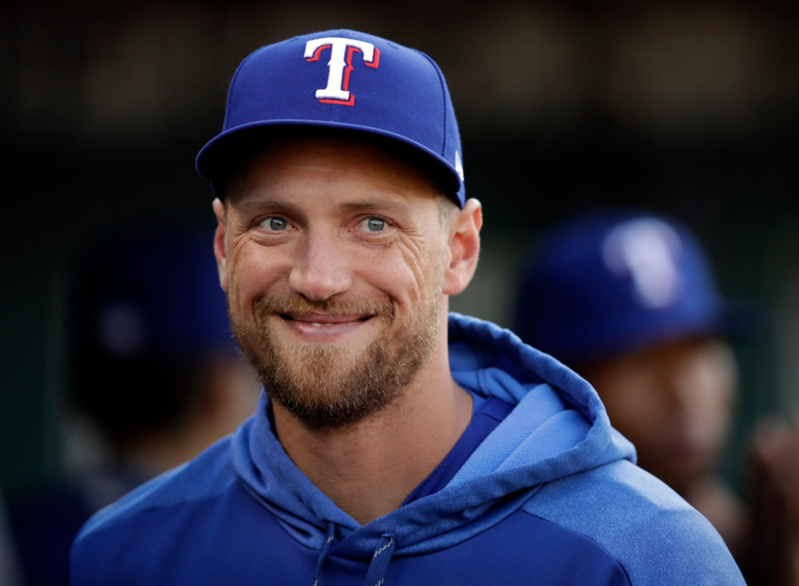 Texas Rangers' Hunter Pence smiles in the dugout prior to the baseball game against the...