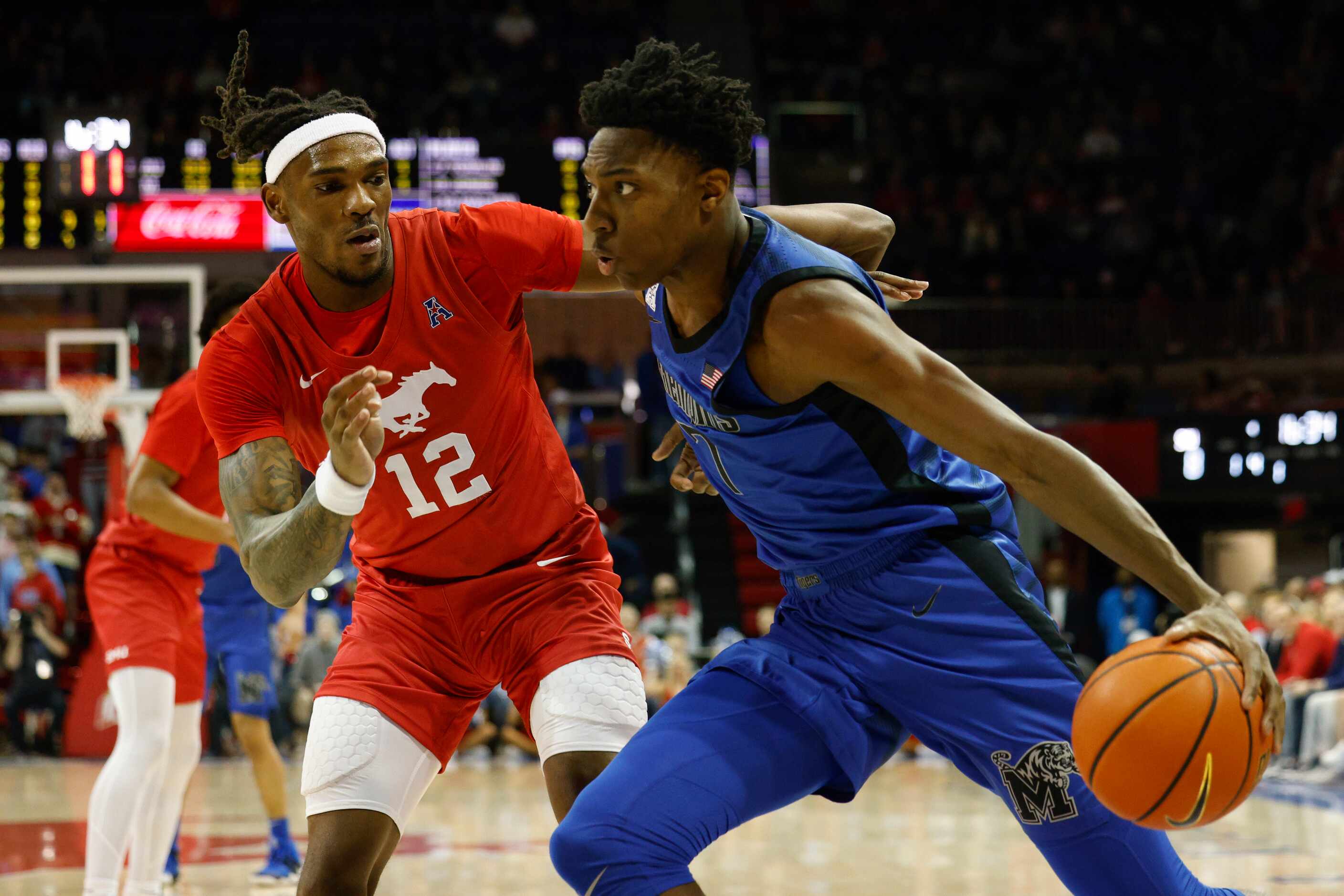 SMU forward Tyreek Smith (12) defends against Memphis forward Nae'Qwan Tomlin (7) during the...