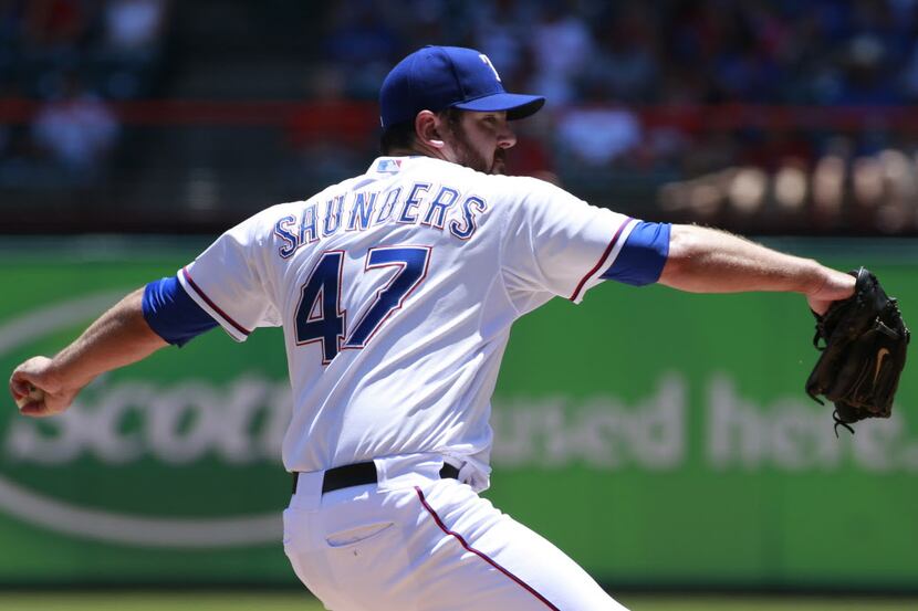 Texas Rangers starting pitcher Joe Saunders (47) throws a pitch in the first inning against...