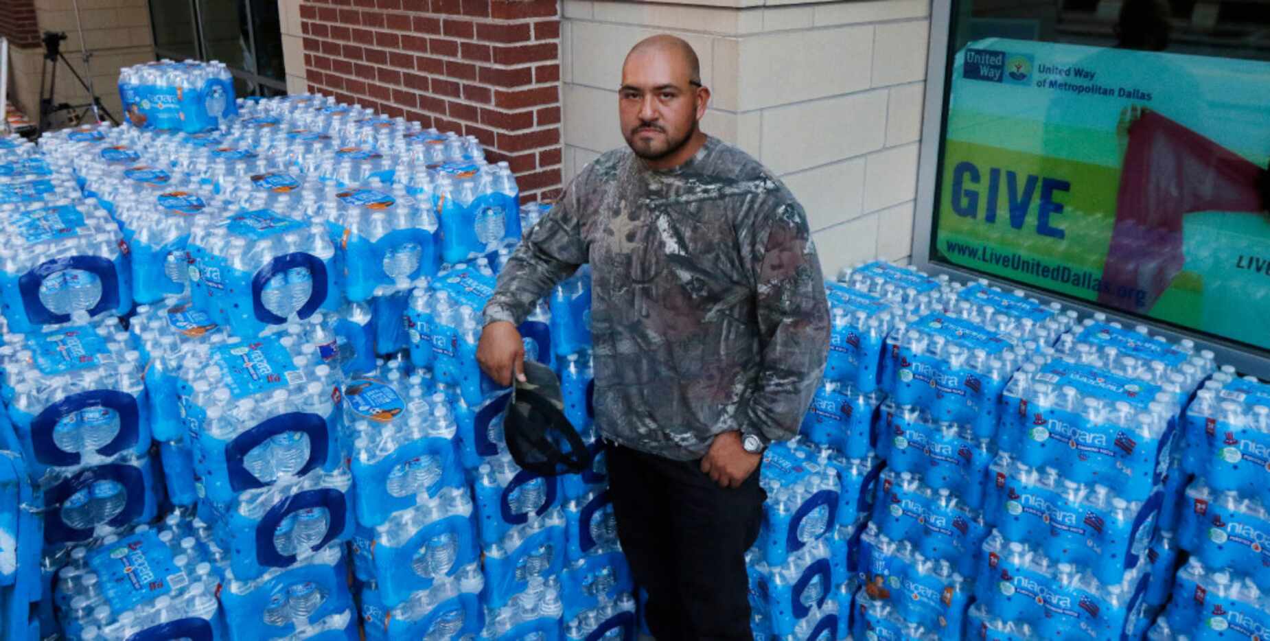 Pedro Frias, 31, of Dallas asked his customers and friends to donate water last week and he...