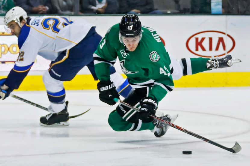Dallas' Valeri Nichushkin (43) is tripped up by St. Louis defender Kevin Shattenkirk (22),...