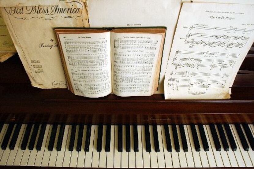 Religious sheet music graces the piano Nov. 6, 2003, in the Montgomery, Ala., home where the...