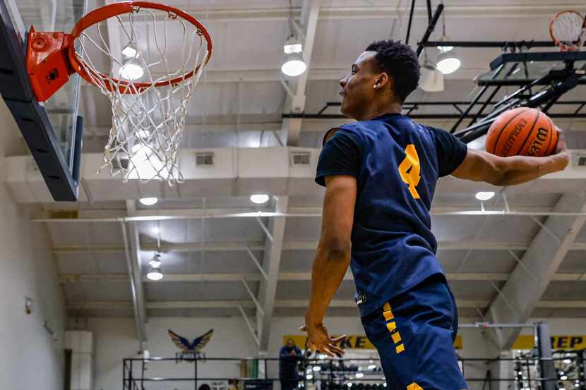 Oak Cliff Faith Family's TJ Caldwell dunks a basketball in Dallas on Wednesday, February 9,...