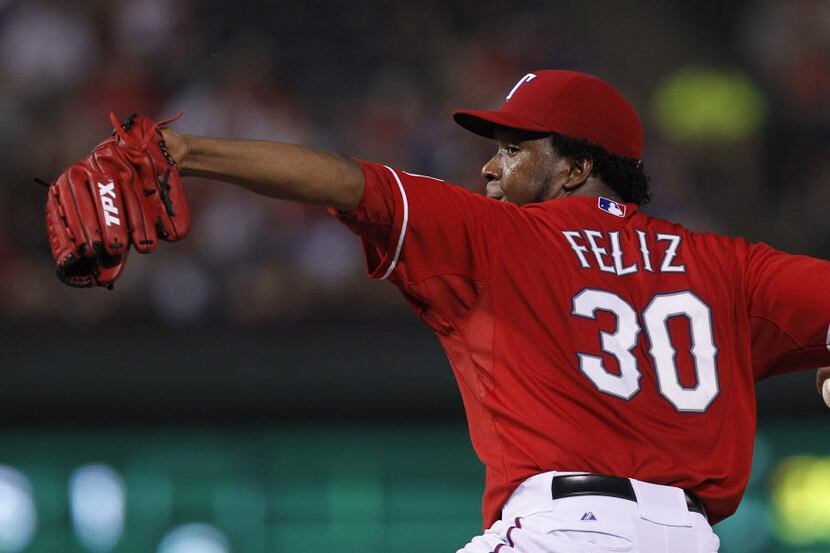 Texas Rangers starting pitcher Neftali Feliz (30) throws against the Seattle Mariners in the...