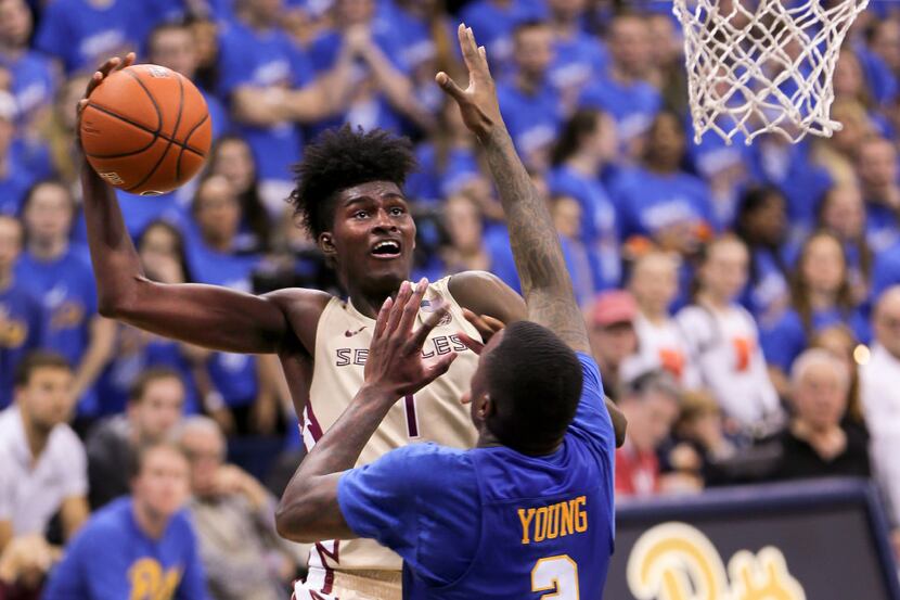 Florida State's Jonathan Isaac (1) shoots over Pittsburgh's Michael Young (2) during the...
