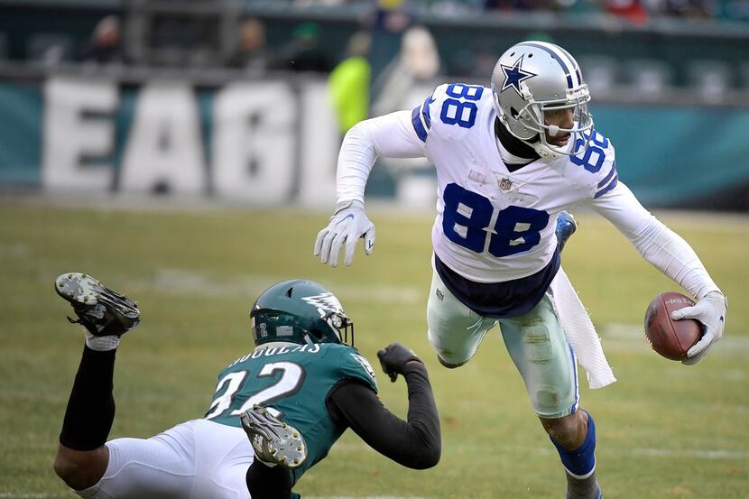 Dallas Cowboys wide receiver Dez Bryant (88) fights for yards over Philadelphia Eagles...