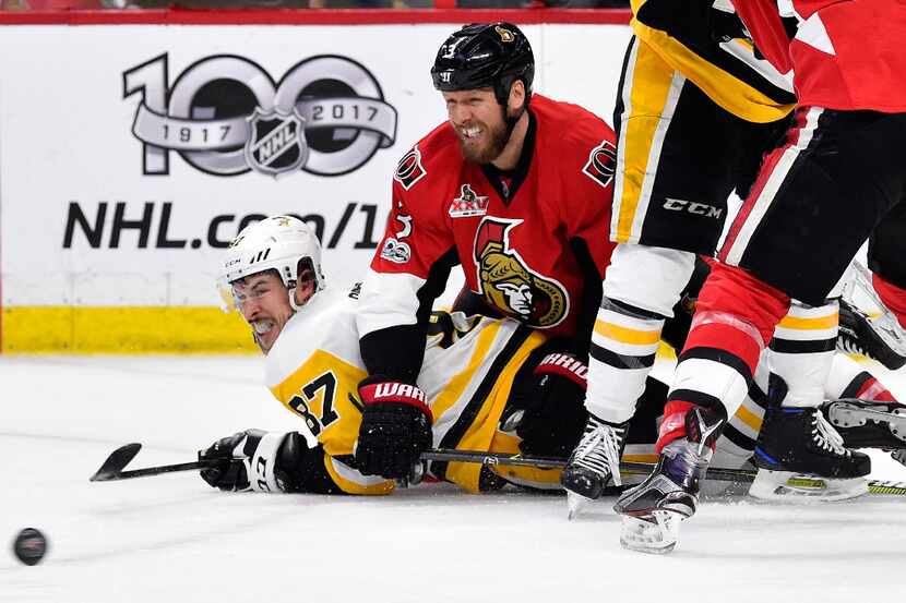 OTTAWA, ON - MAY 23:  Sidney Crosby #87 of the Pittsburgh Penguins and Marc Methot #3 of the...