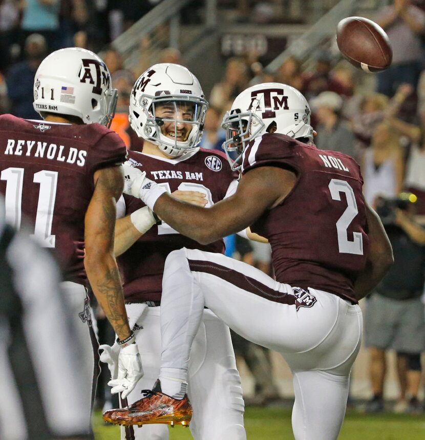 Texas A&M Aggies quarterback Jake Hubenak celebrates with Texas A&M Aggies wide receiver...