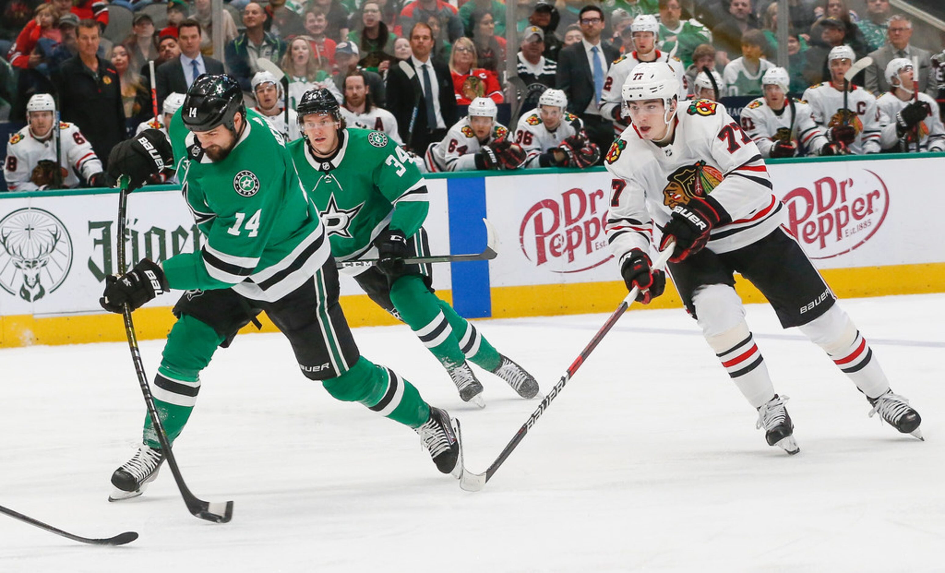 Dallas Stars left wing Jamie Benn (14) takes a shot during the first period of an NHL...