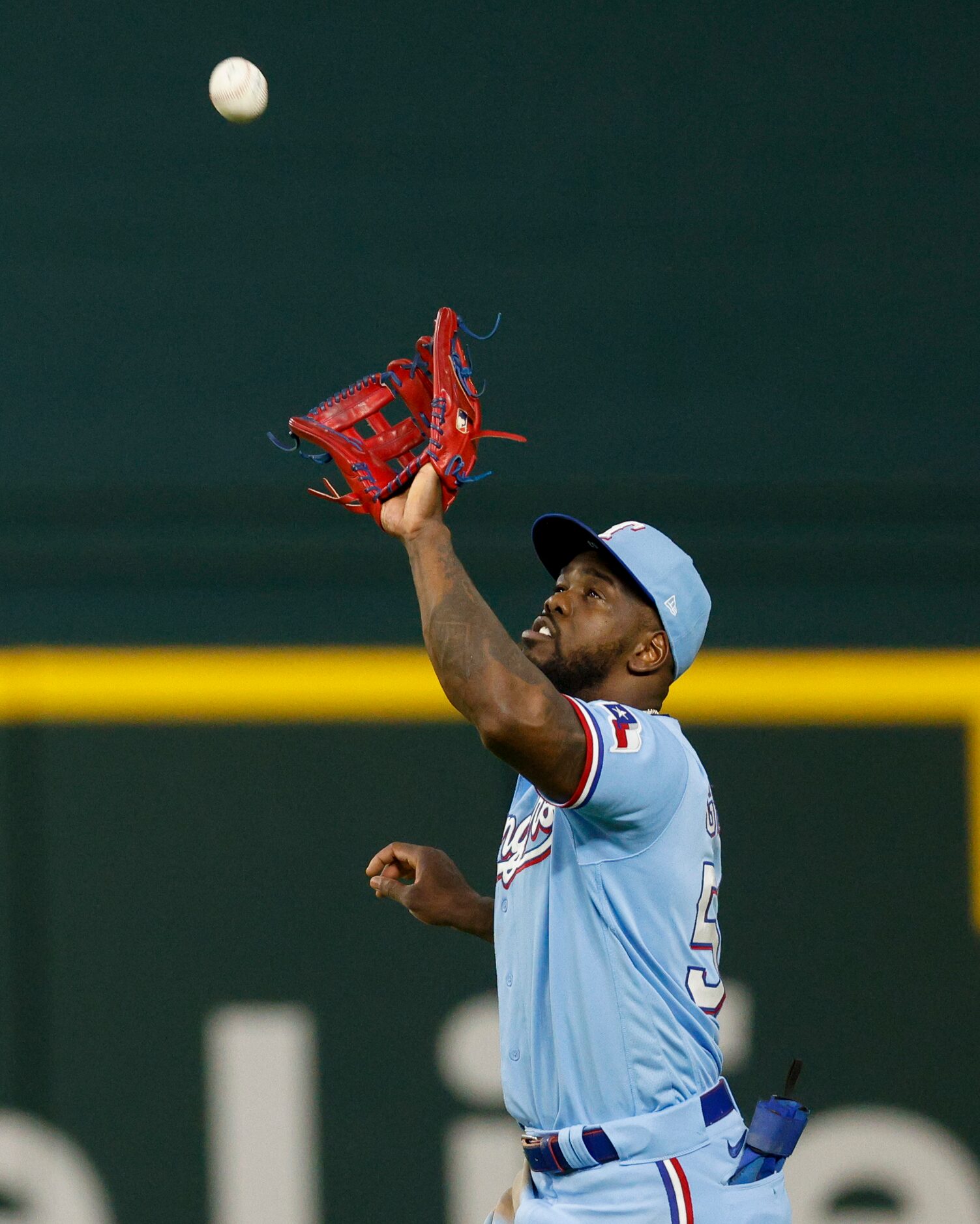 Texas Rangers right fielder Adolis Garcia (53) catches the ball for an out during the fifth...