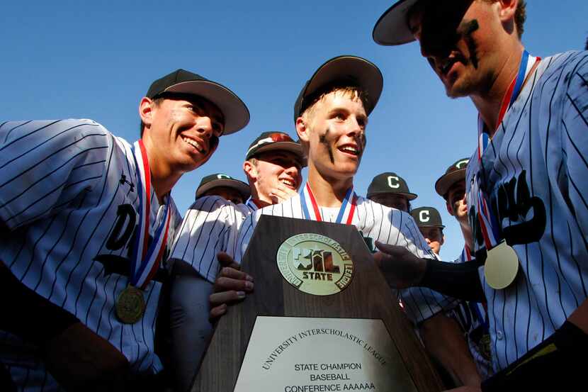 Members of the Southlake Carroll Dragons soak in the moment after winning their final game...