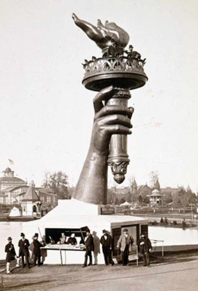 In this photo released by Agence Papyrus, the hand and flame of the Statue of Liberty,...