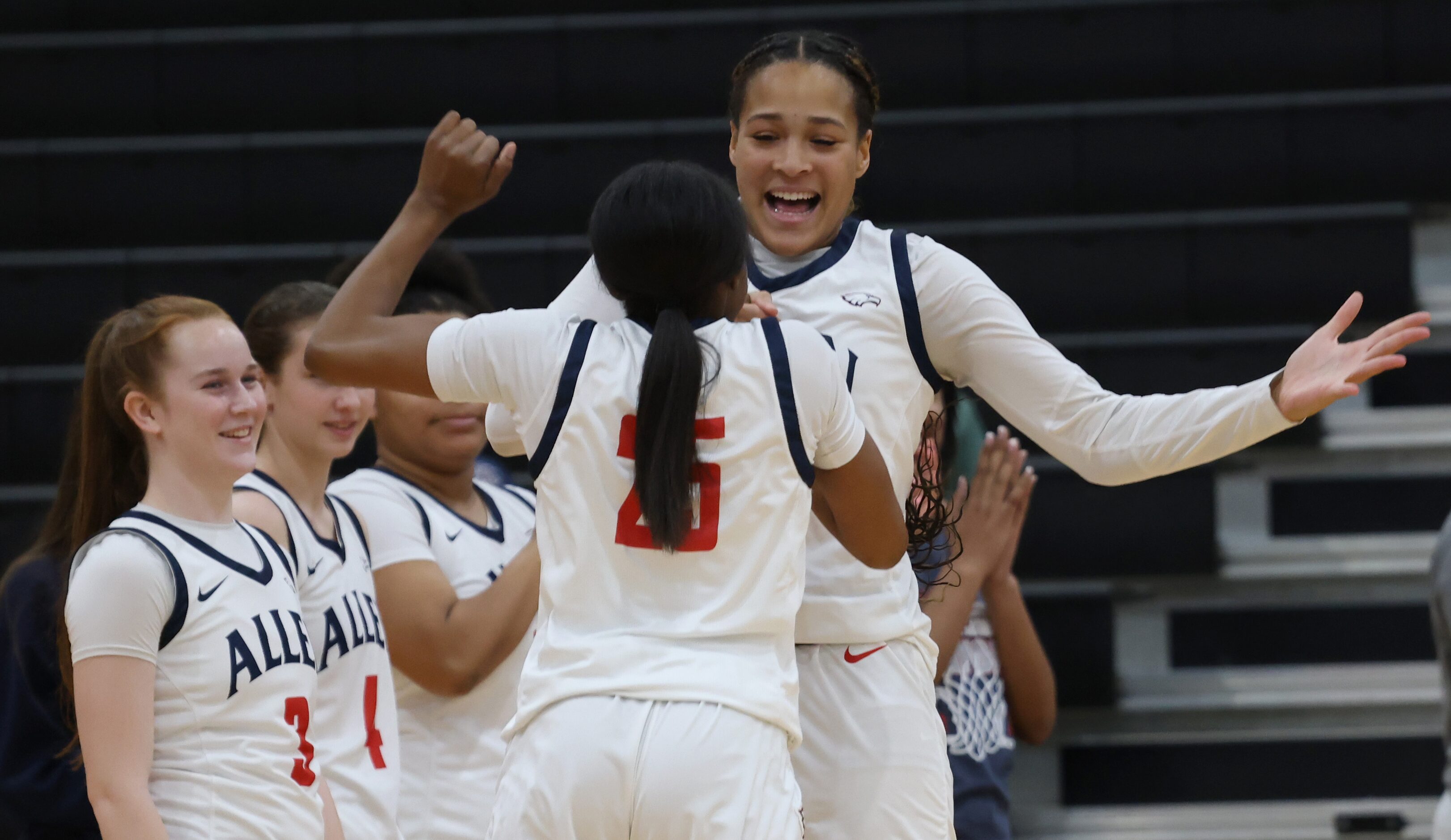 Allen's Aryn Roberts (23), facing camera, reacts during player introductions prior to the...