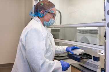 Dr. Florence Haseltine helps set up UT-Arlington's COVID-19 test facility at the North Texas...