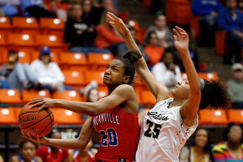 Duncanville's Aniya Thomas is fouled by Keller's Kaitlyn Guillory (25) during the second...