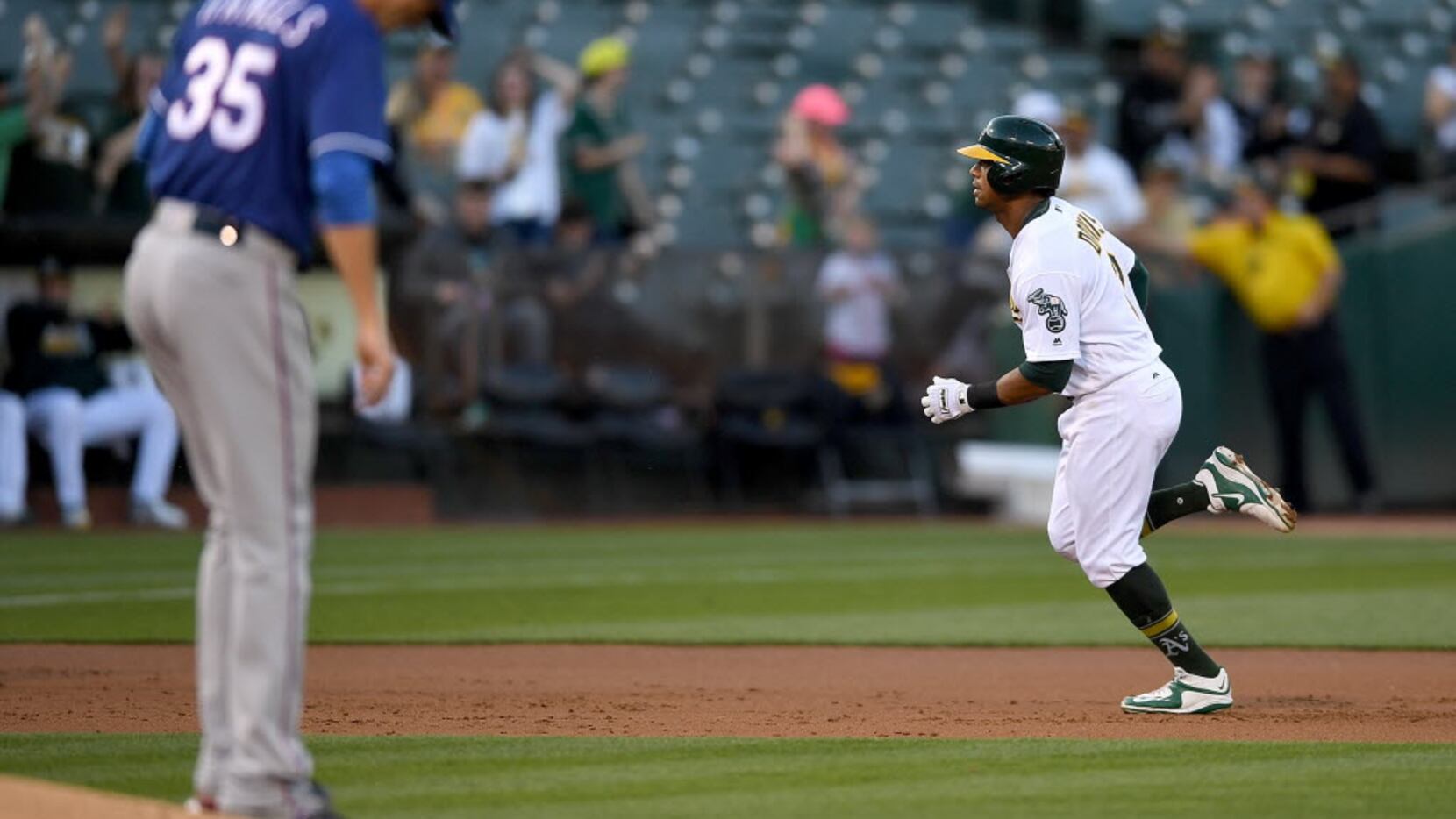 OAKLAND, CA - MAY 17:  Khris Davis #2 of the Oakland Athletics trots around the bases after...