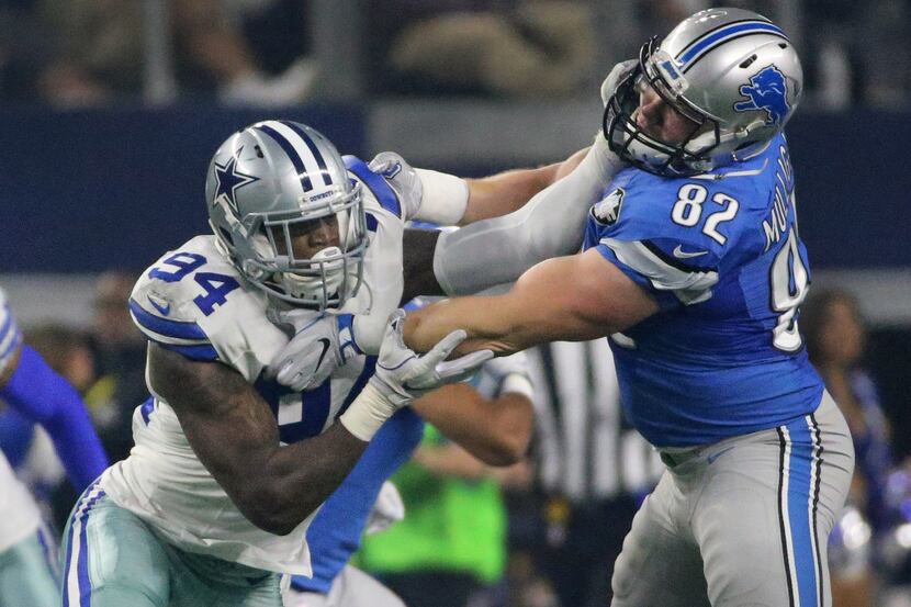 Dallas Cowboys defensive end Randy Gregory (94) rushes the passer as Detroit Lions tight end...