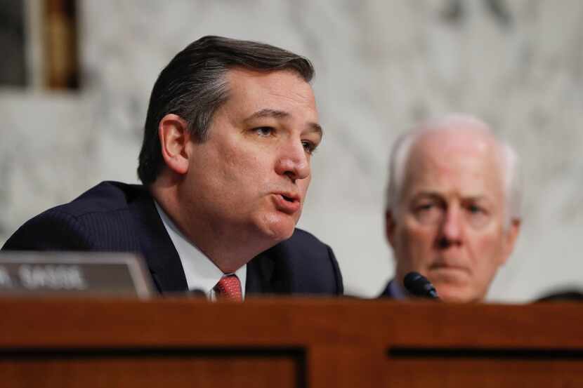 Sen. Ted Cruz, R-Texas (left), questions former Acting Attorney General Sally Yates and...