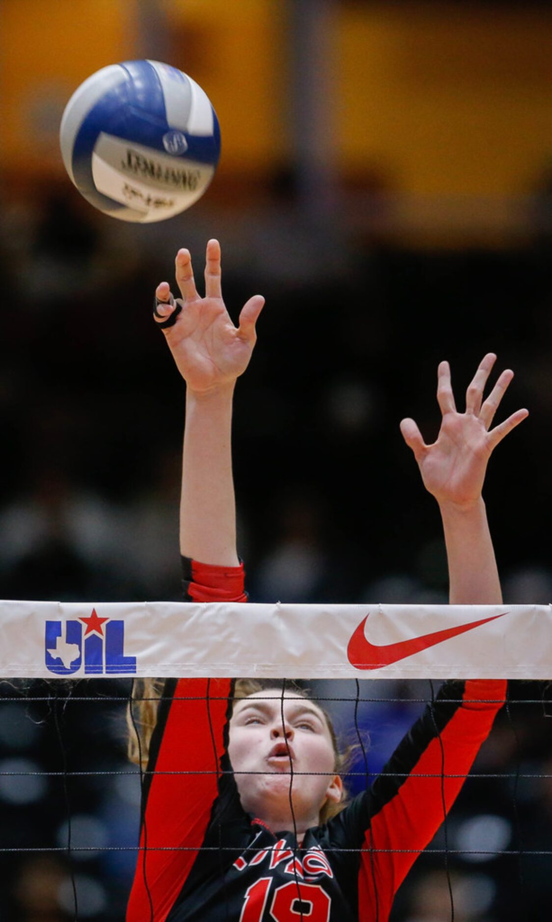 LovejoyÃs Lexie Collins (19) attempts to block the ball in the third set of a class 5A...