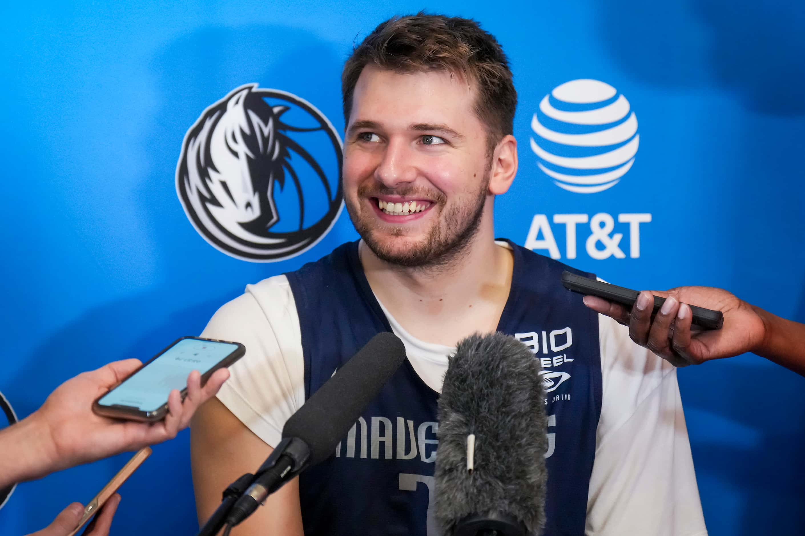 Dallas Mavericks guard Luka Doncic smiles he addresses reporters after the team practiced in...