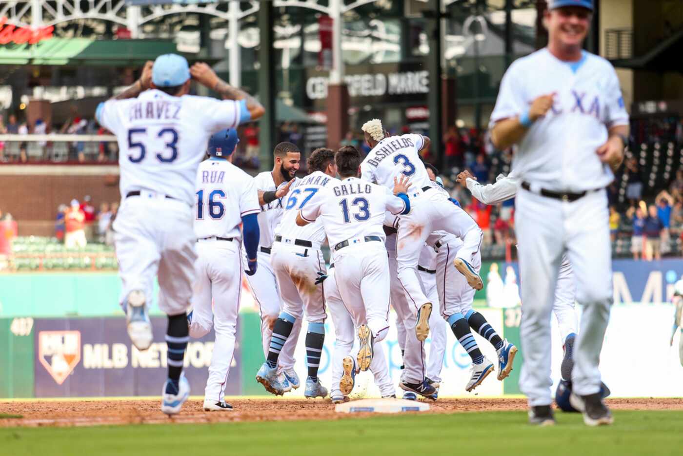 ARLINGTON, TX - JUNE 17: Texas Rangers players celebrate with Jose Trevino #71 of the Texas...