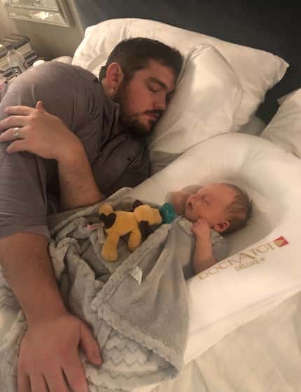 Cowboys offensive lineman Zack Martin takes a nap with his son Charlie.