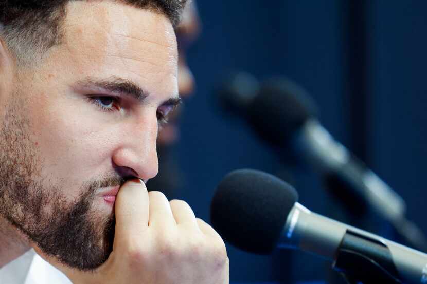 Klay Thompson listens during a NBA news conference where he was introduced as one of the...