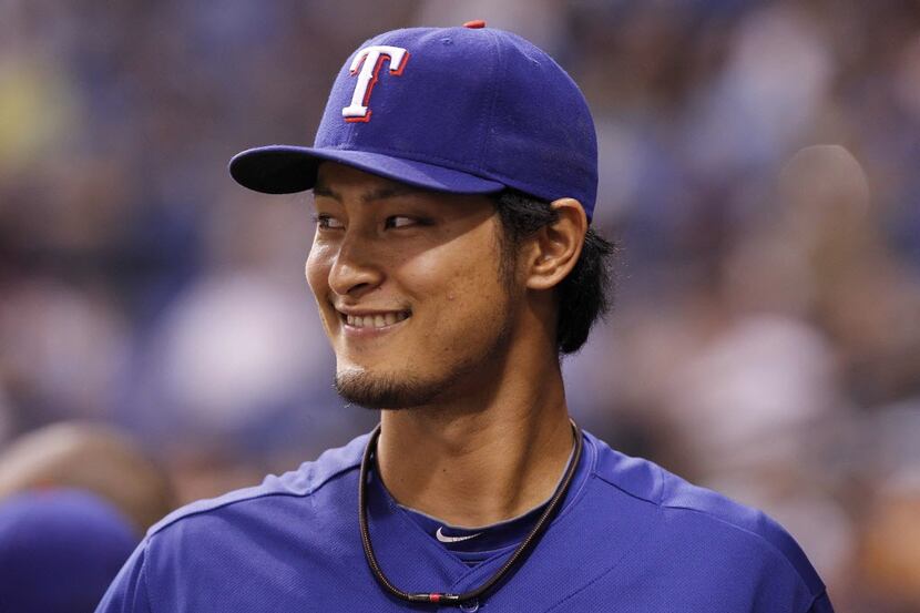 Sep 17, 2013; St. Petersburg, FL, USA; Texas Rangers pitcher Yu Darvish (11) stands in the...
