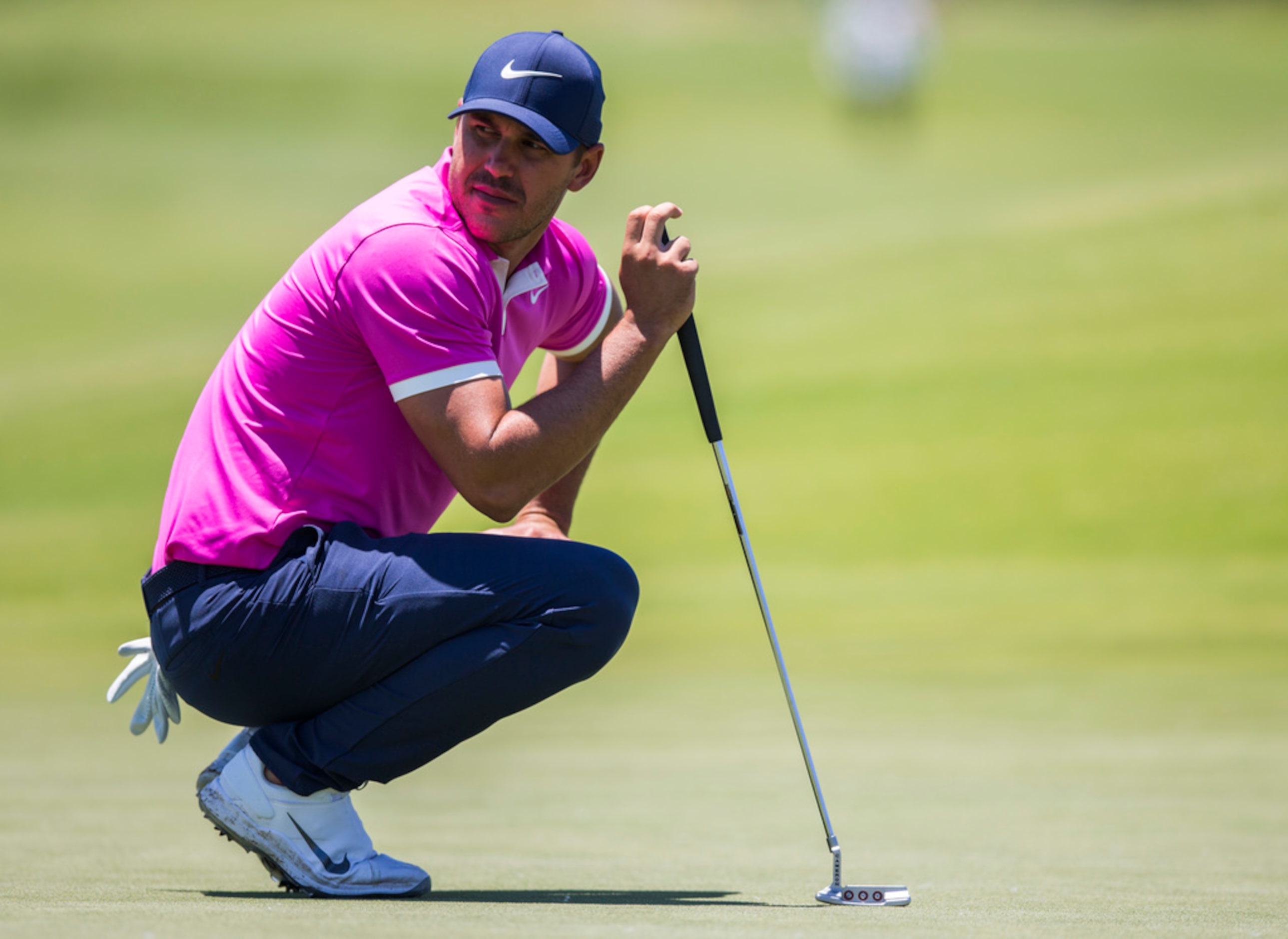 Brooks Koepka looks around the third green during round 4 of the AT&T Byron Nelson golf...