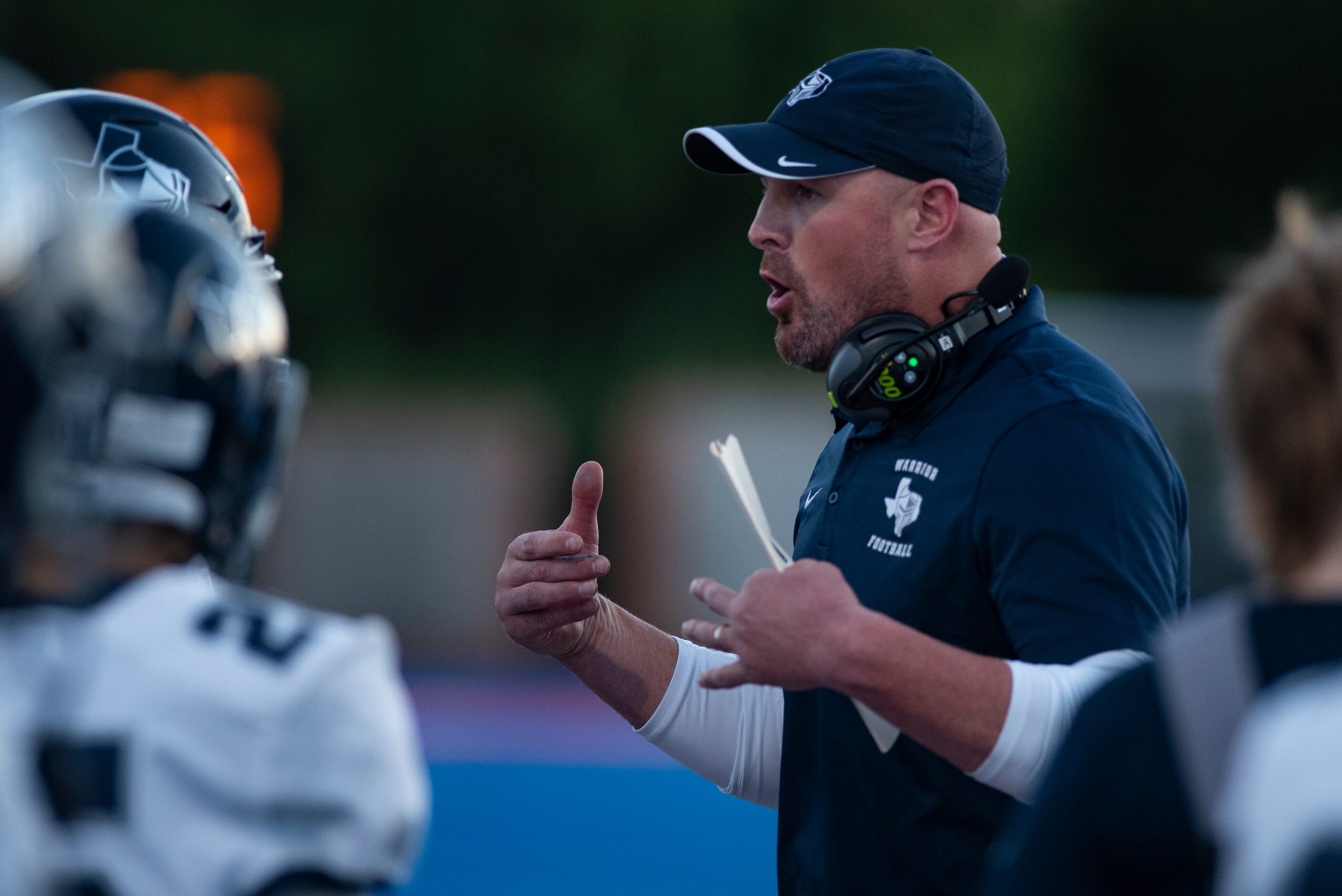 Argyle Liberty Christian Head Coach Jason Witten explains a play to his team during Parish...