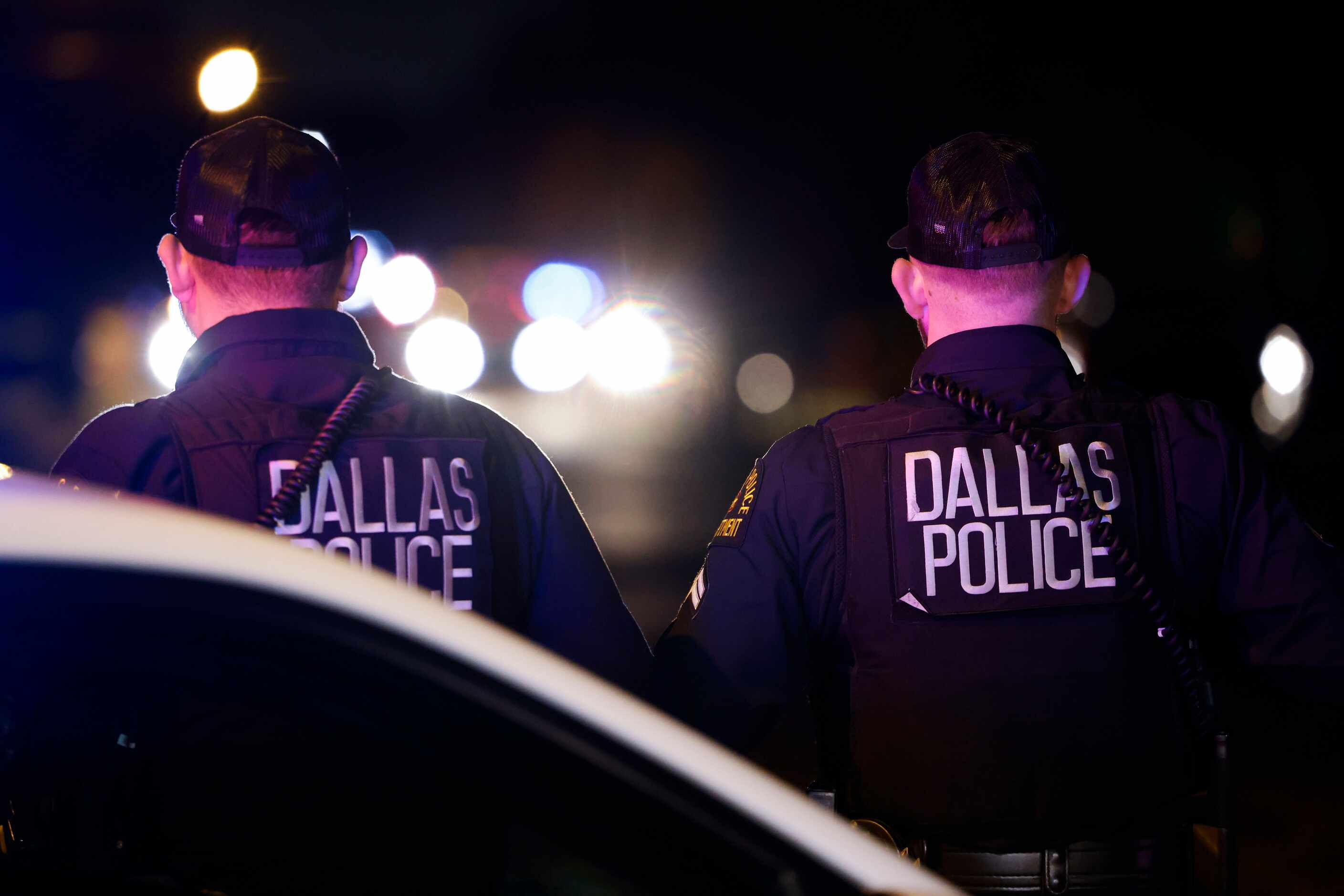 Dallas Police Department remain on a homicide scene leaving four people dead and a teenage...