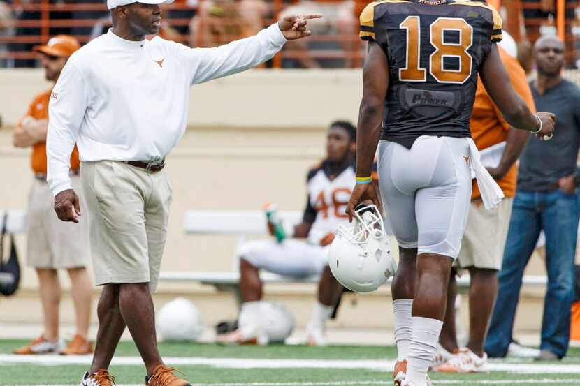 April 18, 2105: Texas Longhorns head coach Charlie Strong talks with quarterback Tyrone...