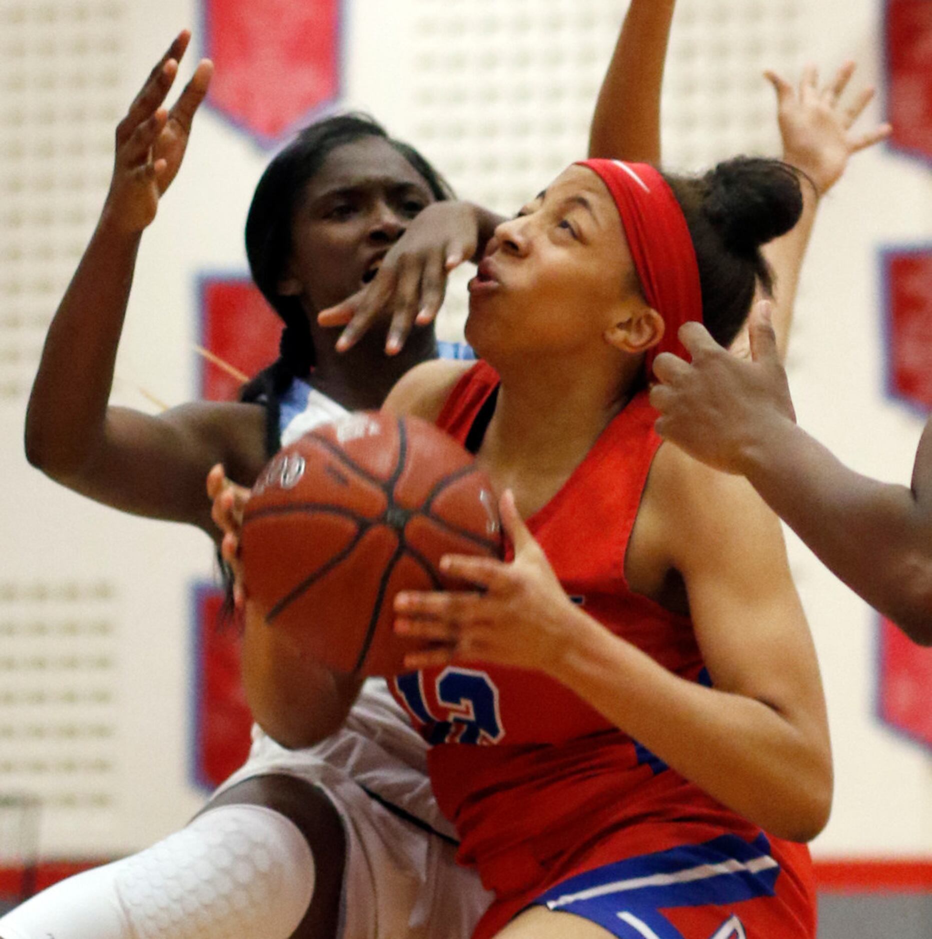 Duncanville's Zaria Rufus (12) is fouled by Dallas Skyline's Jaida McDonald (13) as she...