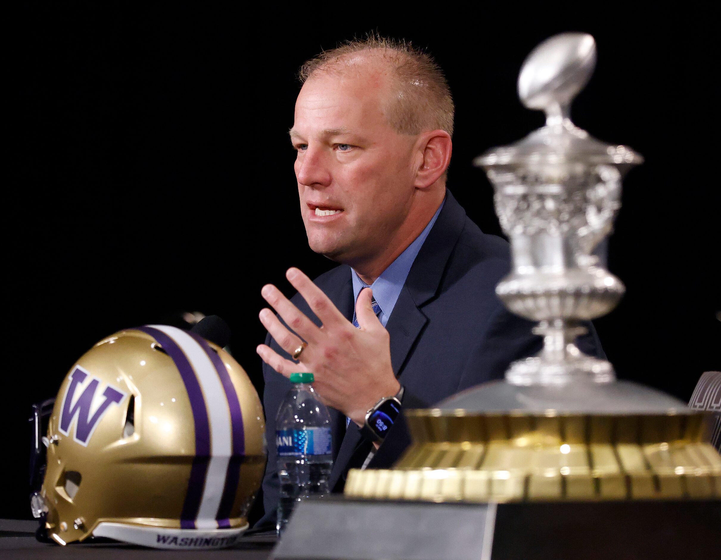 Washington head coach Kalen DeBoer answers questions from the media pose during his joint...