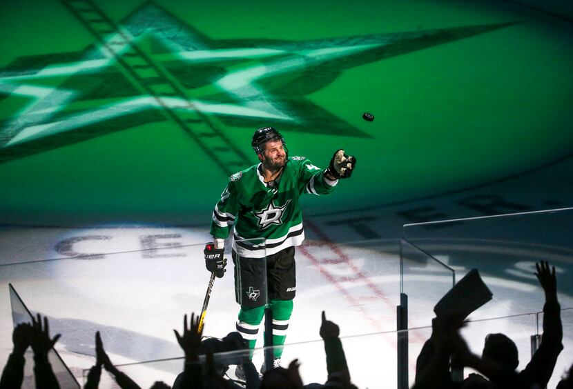 Dallas Stars right wing Alexander Radulov (47) gives a fan a game puck following the Stars...