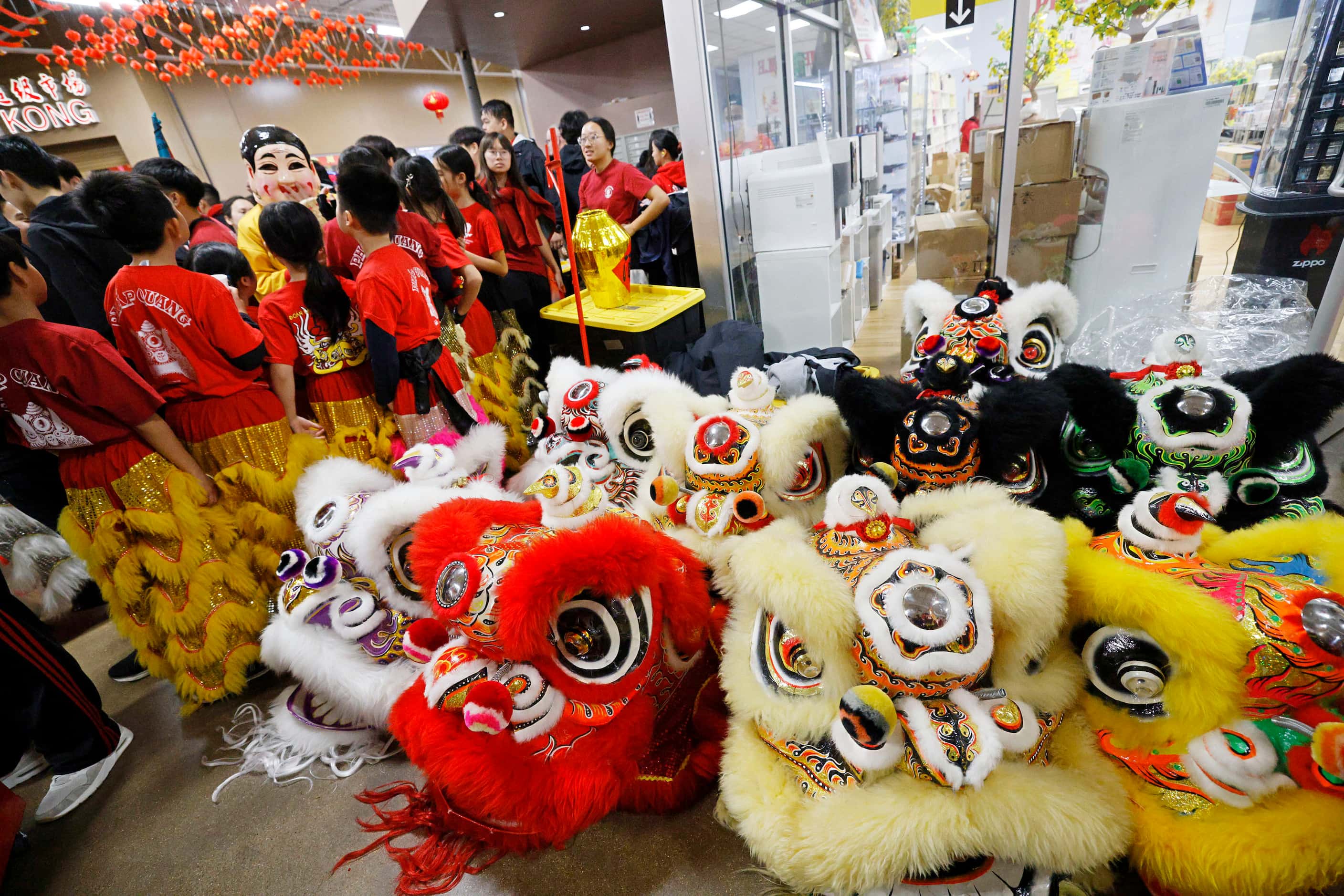 Lion dancers from GDPT Phap Quang wait for their performance during a Luna New Year...