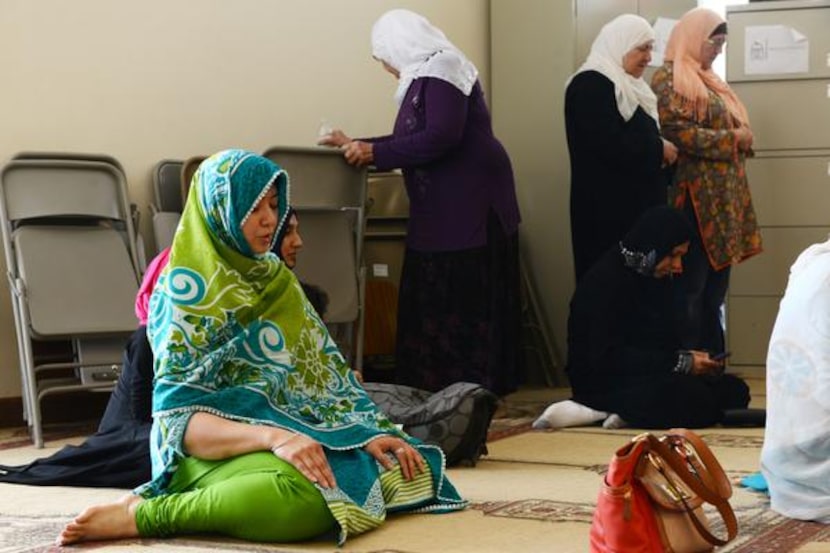 
Saba Hassan, a member of the East Plano Islamic Center, prays inside the current facility....